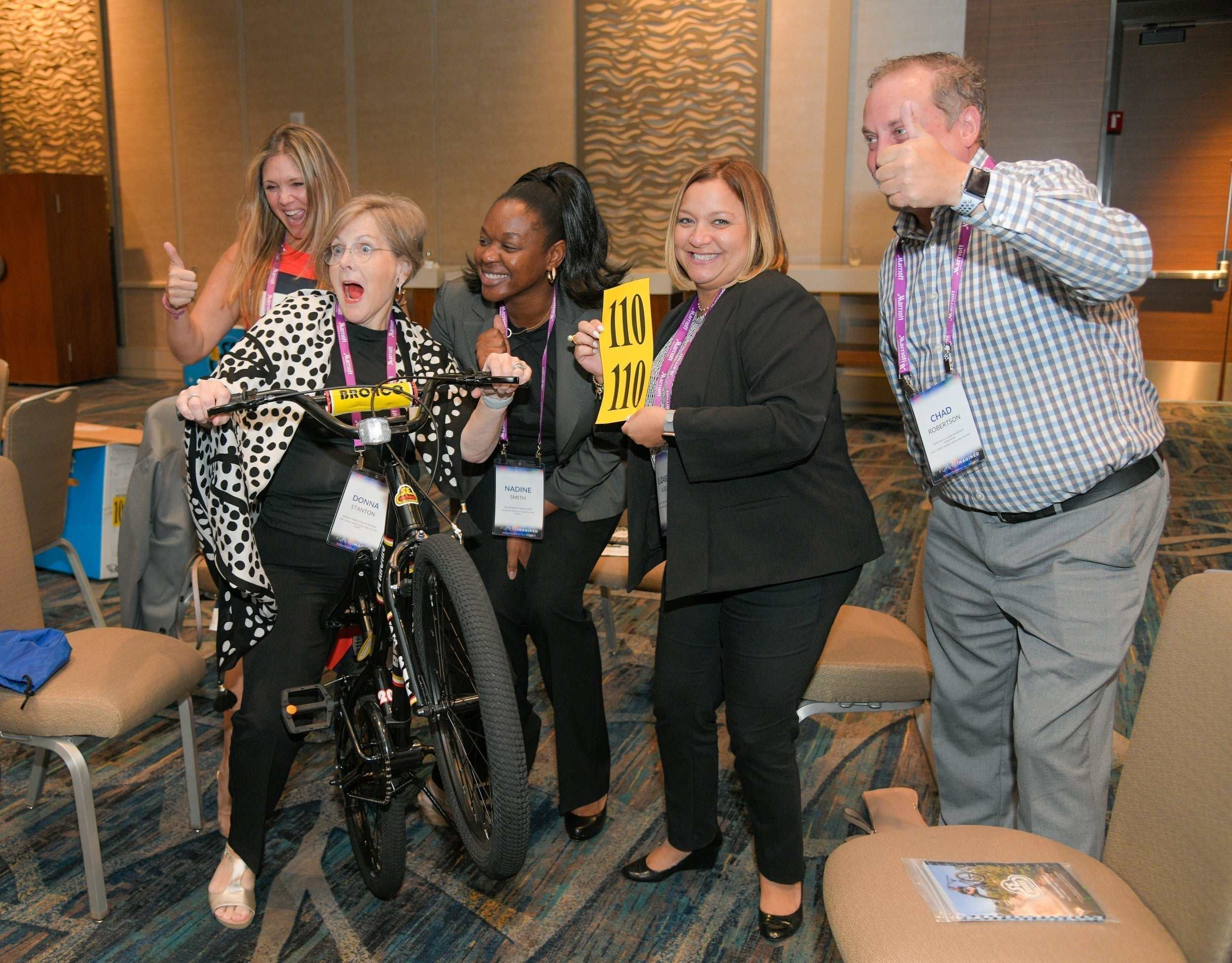 Kaiser Permanente employees participating in a corporate team building event assembling prosthetic hands for philanthropic impact