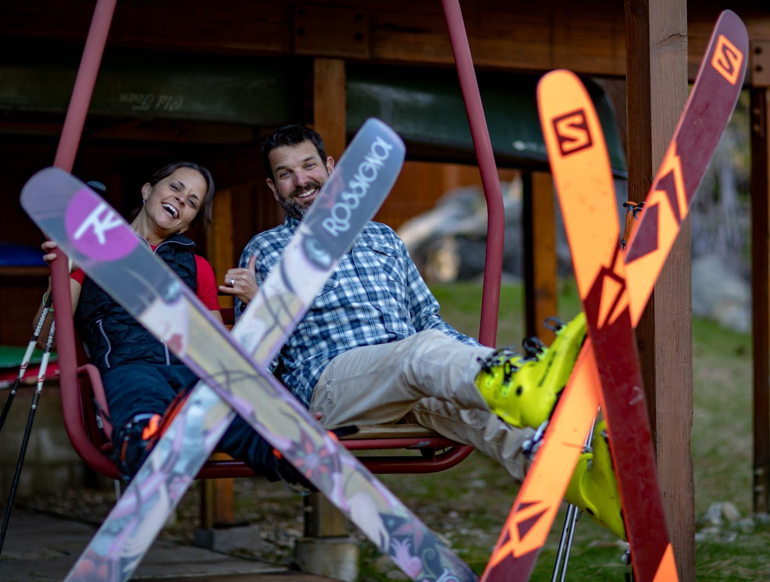 Three skiers carving fresh lines on a snowy Lake Tahoe slope during Skiing the Leadership Summit