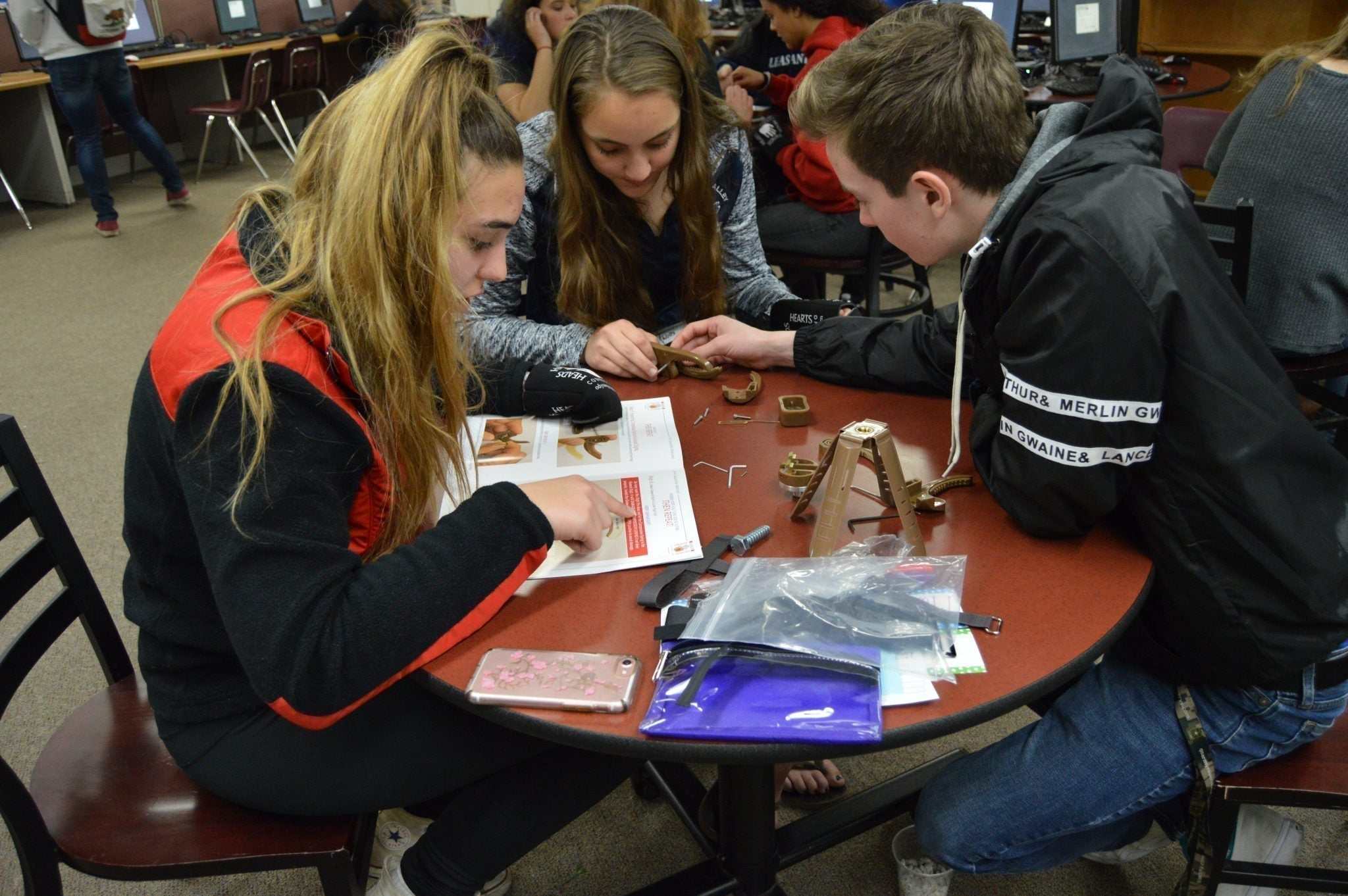 Students engaged in classroom teamwork activities collaborating on group projects