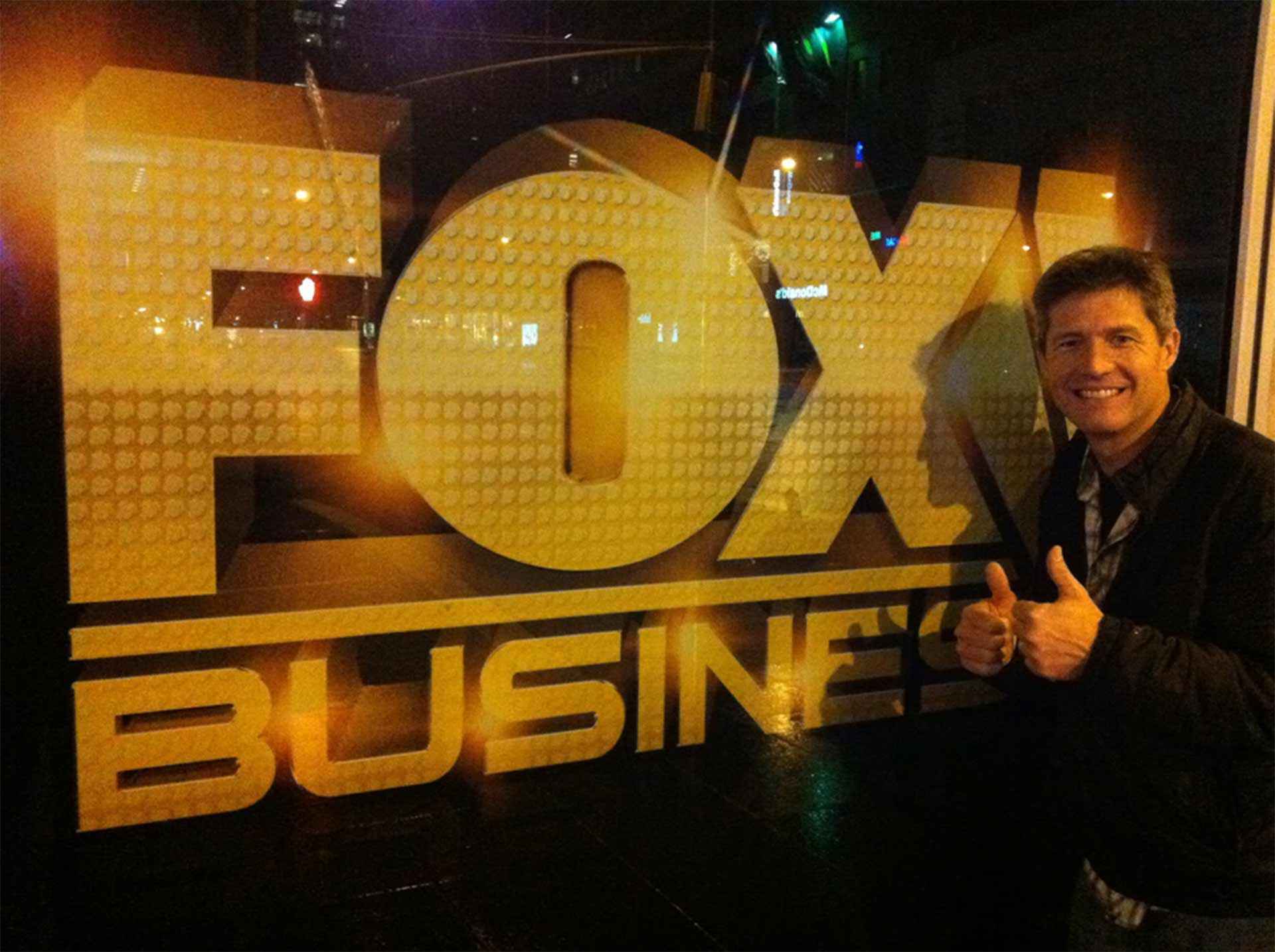 Lain Hensley discussing Odyssey Teams' impact on corporate philanthropy programs on Fox Business studio set