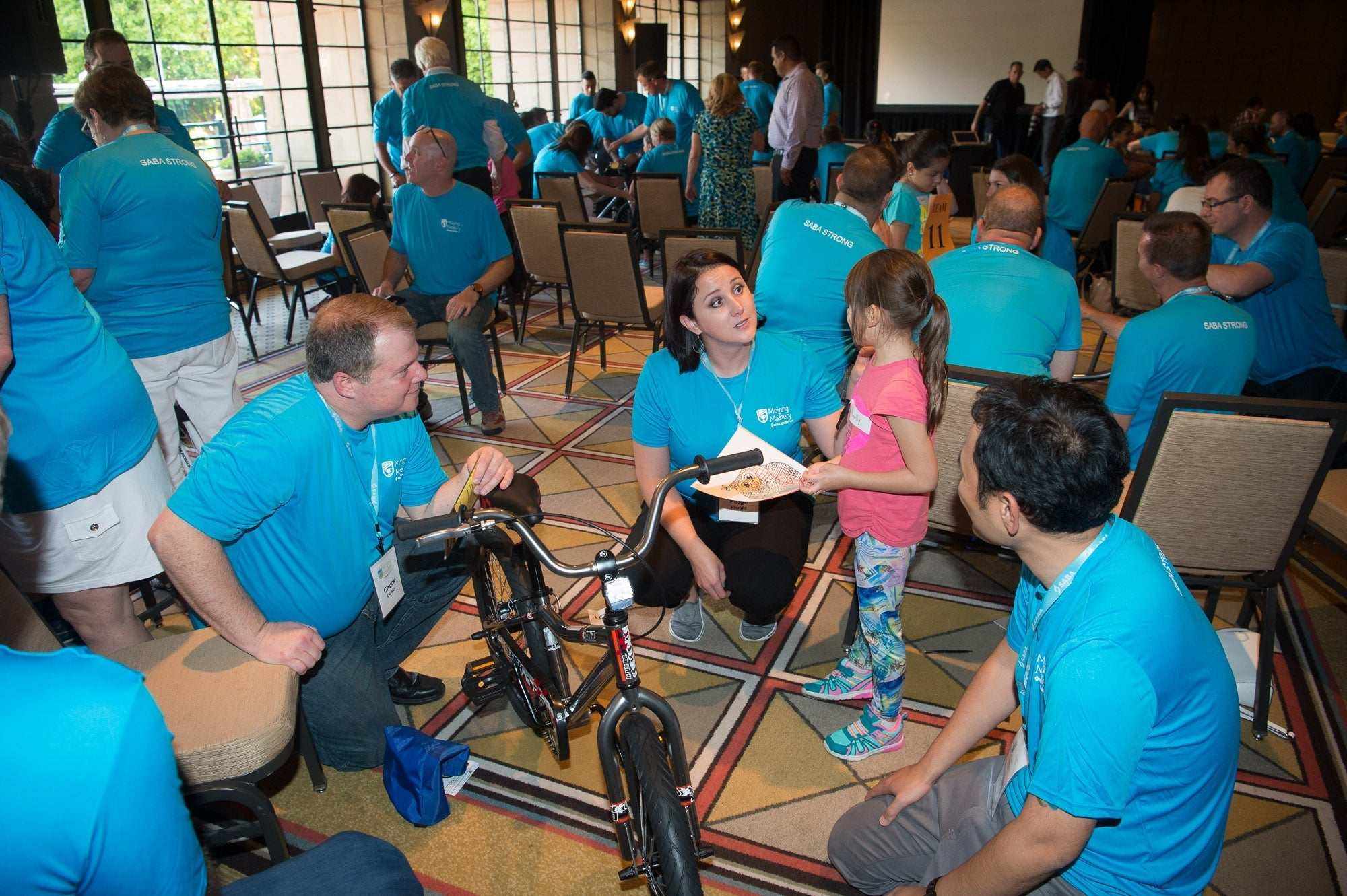 Team building with bike assembly illustrating life cycles and collaboration lessons