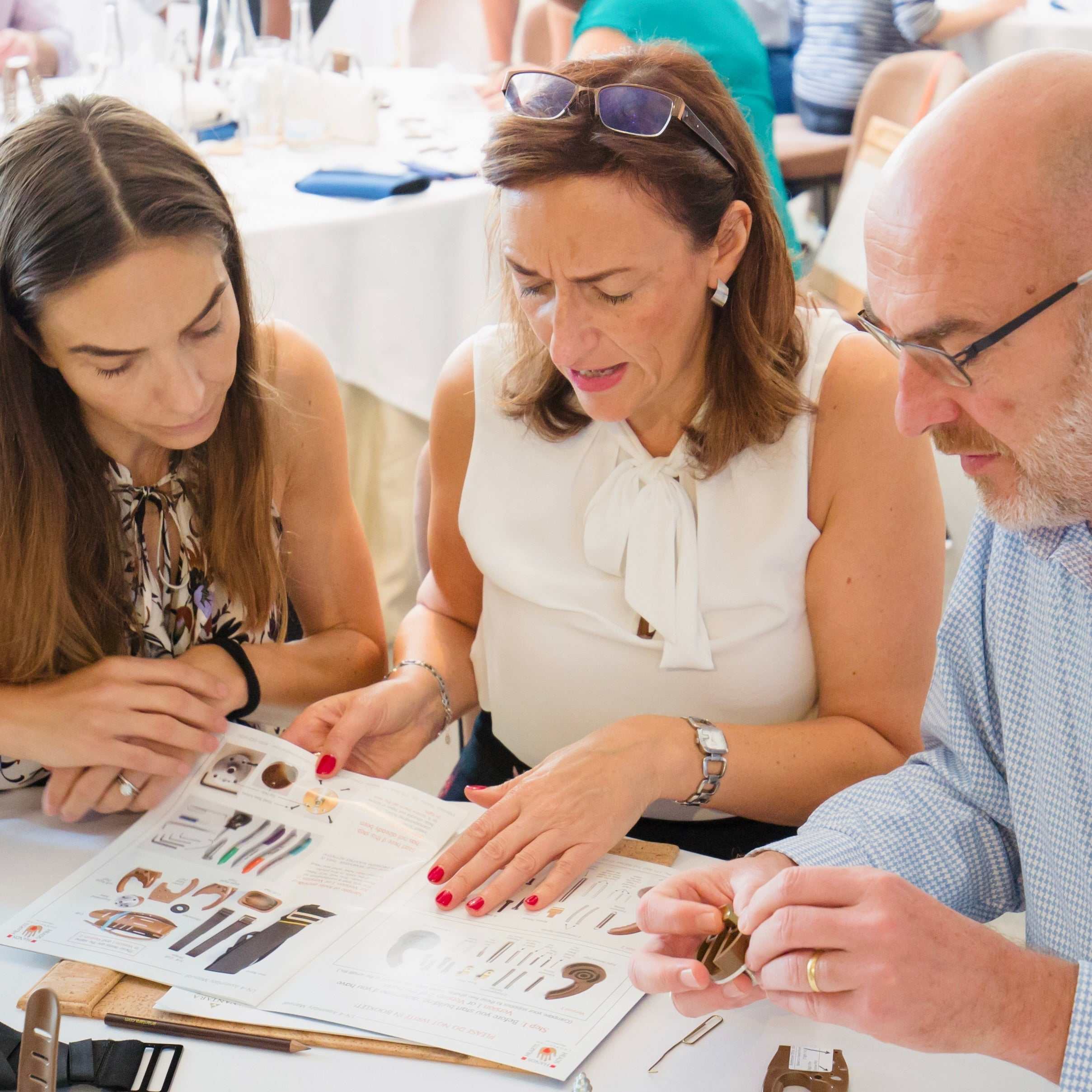 Team building activity assembling prosthetic hand with Build-A-Hand® Team Building Kit