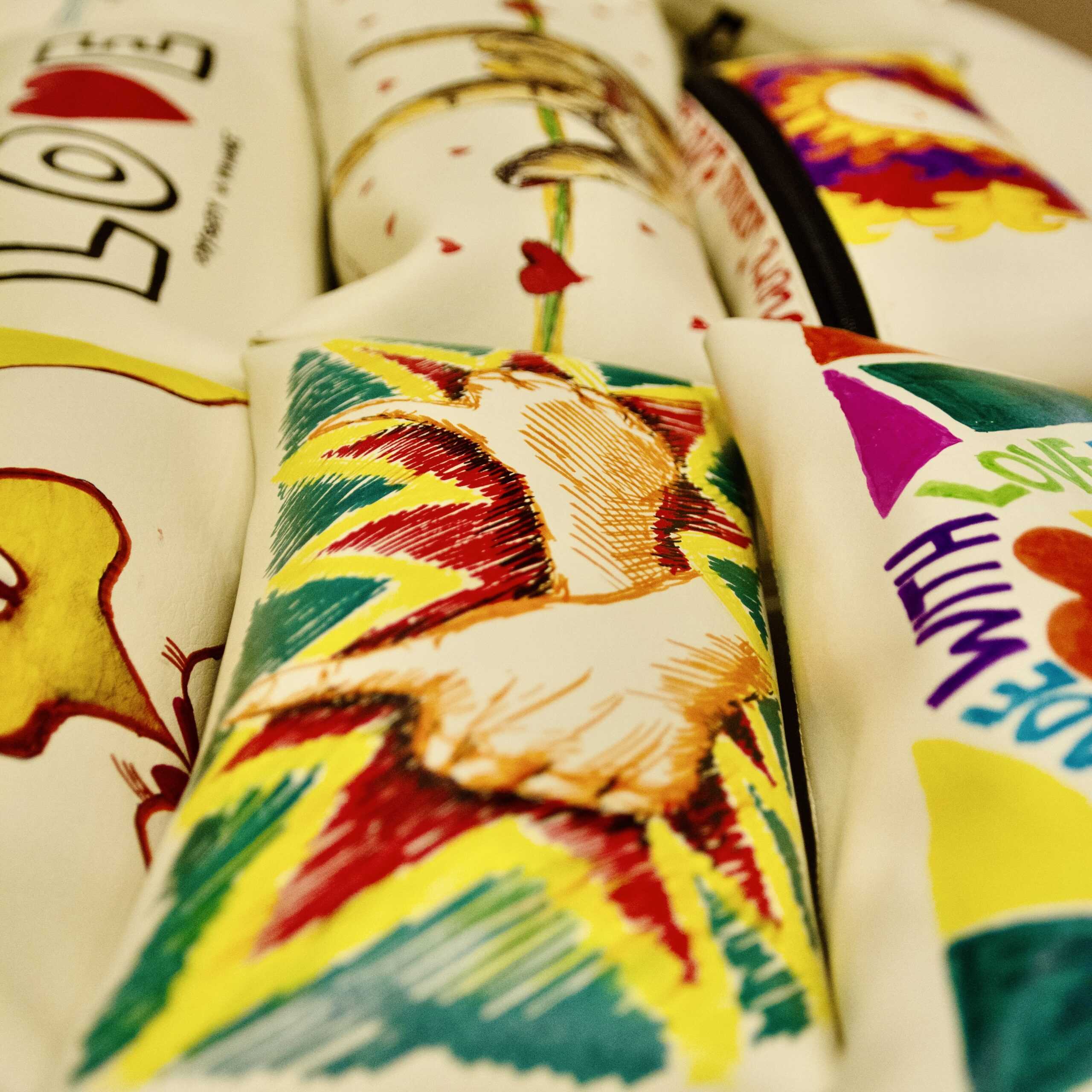 Build-A-Hand® Team Building Kit colorful prosthetic hand parts with artwork for virtual or in-person team activity