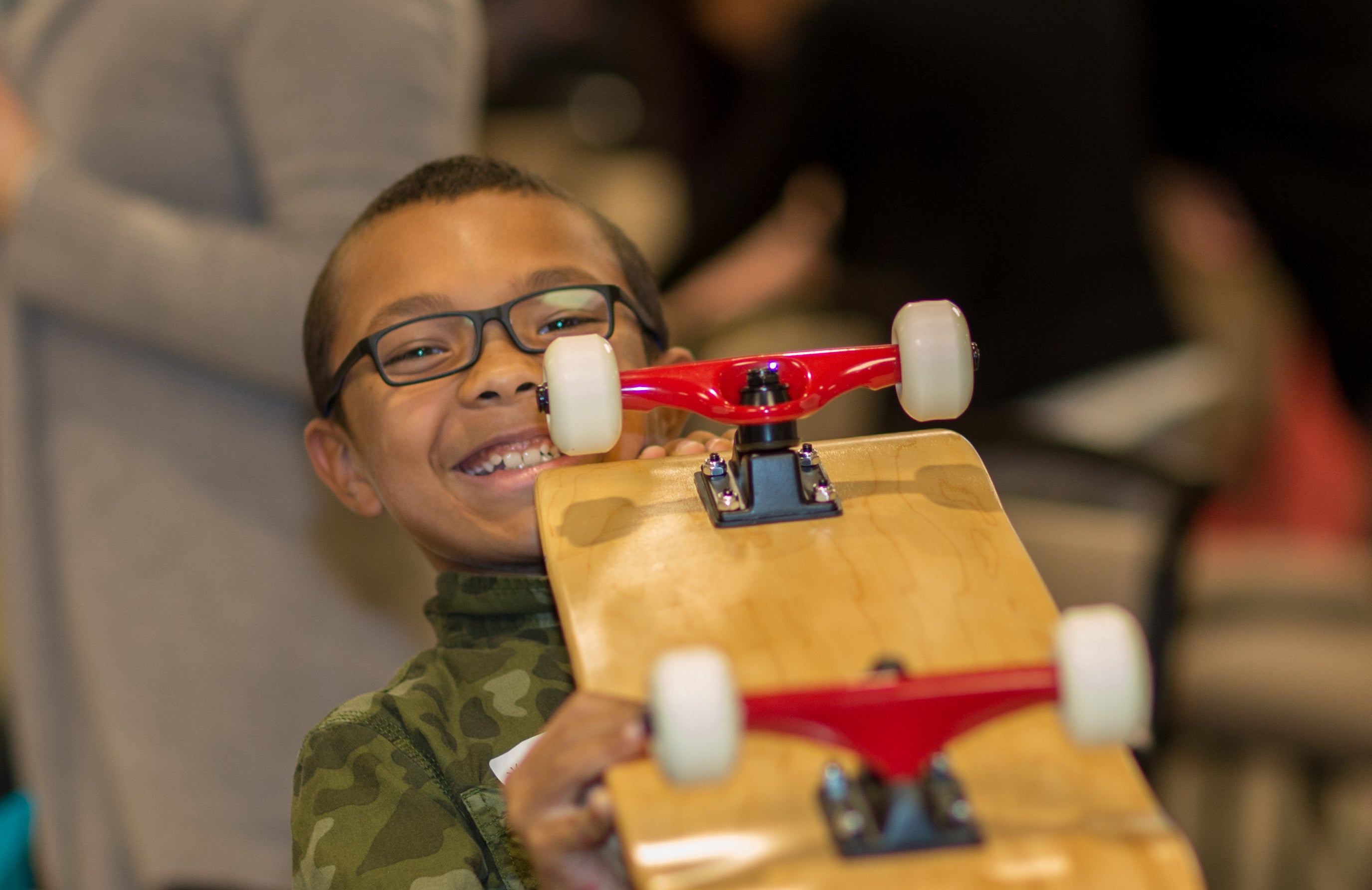 Kid holding skateboard